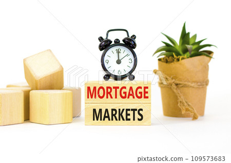 Mortgage markets symbol. Concept words Mortgage markets on beautiful wooden blocks. Beautiful white table white background. Black alarm clock. Business mortgage markets concept. Copy space. Mortgage markets symbol. Concept words Mortgage markets on beautiful wooden blocks. Beautiful white table white background. Black alarm clock. Business mortgage markets concept. Copy space. 109573683