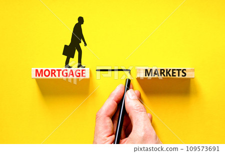 Mortgage markets symbol. Concept words Mortgage markets on beautiful wooden blocks. Businessman icon. Beautiful yellow table yellow background. Business mortgage markets concept. Copy space. Mortgage markets symbol. Concept words Mortgage markets on beautiful wooden blocks. Businessman icon. Beautiful yellow table yellow background. Business mortgage markets concept. Copy space. 109573691