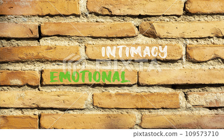 Emotional intimacy symbol. Concept words Emotional intimacy on beautiful brown brick wall. Beautiful brown brick wall background. Psychology emotional intimacy concept. Copy space. 109573710