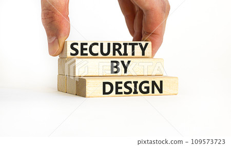 Security by design symbol. Concept words Security by design on wooden blocks on a beautiful white table white background. Businessman hand. Business finacial security by design concept. Copy space. Security by design symbol. Concept words Security by design on wooden blocks on a beautiful white table white background. Businessman hand. Business finacial security by design concept. Copy space. 109573723