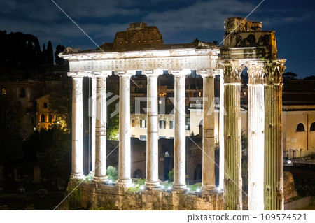 Scenic night view of Roman Forum site illuminated columns Scenic night view of Roman Forum site illuminated columns 109574521