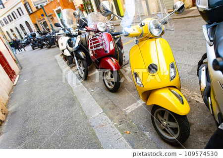 Set of modern and vintage scooters on streets of Rome Set of modern and vintage scooters on streets of Rome 109574530