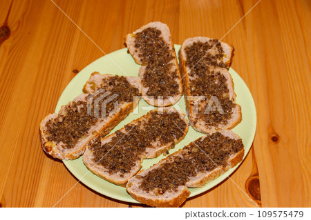 Sandwiches with truffle sauce on wooden table Sandwiches with truffle sauce on wooden table 109575479