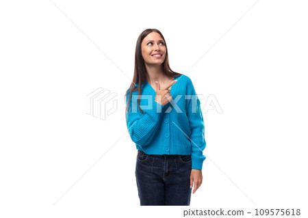 charming cute young woman dressed in a blue pullover reflects on inspiration charming cute young woman dressed in a blue pullover reflects on inspiration 109575618