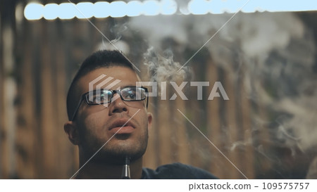Arabic jordanian young man smokes a hookah. 109575757