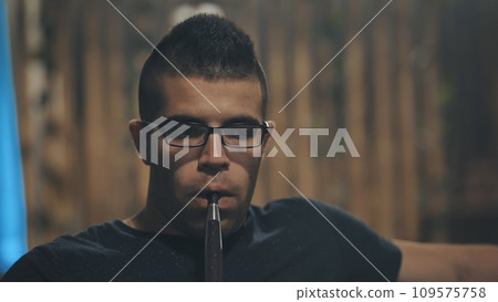 Arabic jordanian young man smokes a hookah. 109575758