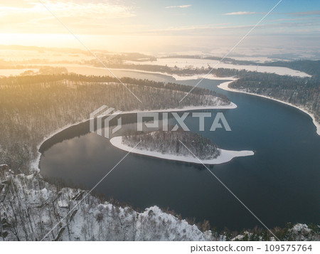 Sec water reservoir with small forested island in the middle. Iron Mountains, Czechia. Aerial view from drone. 109575764