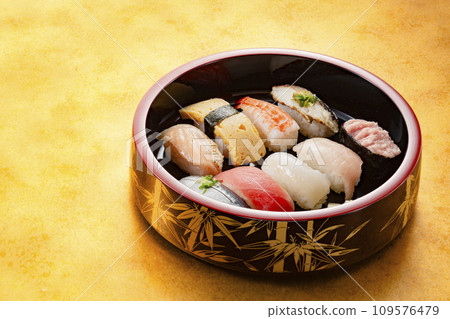 Delicious-looking sushi in a lacquered wooden bucket Delicious-looking sushi in a lacquered wooden bucket 109576479