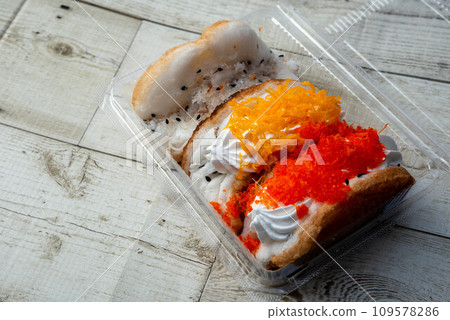 "Khanom tang taek" is a delicious and popular Thai street food snack. These crispy, deep-fried pastries are also known as "fried bread" or "crispy pancakes." Here's more information about khanom tang 109578286