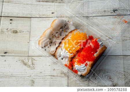 "Khanom tang taek" is a delicious and popular Thai street food snack. These crispy, deep-fried pastries are also known as "fried bread" or "crispy pancakes." Here's more information about khanom tang 109578288