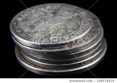 Stack of old vintage silver medieval taller coins 109578418