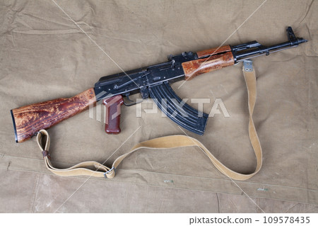 Top view of the Kalashnikov AKM or AK47 on green canvas Top view of the Kalashnikov AKM or AK47 on green canvas 109578435