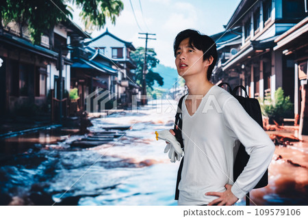 A man evacuates from a city flooded by heavy rain A man evacuates from a city flooded by heavy rain 109579106