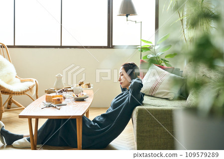 A woman relaxing in the living room 109579289