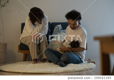 A tired couple dealing with their baby's night crying won't stop crying. 109581395