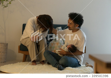 A tired couple dealing with their baby's night crying won't stop crying. 109581396
