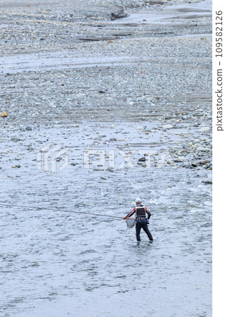 Image of a man enjoying sweetfish fishing Image of a man enjoying sweetfish fishing 109582126