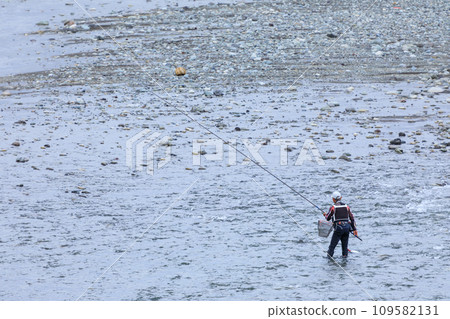 Image of a man enjoying sweetfish fishing Image of a man enjoying sweetfish fishing 109582131