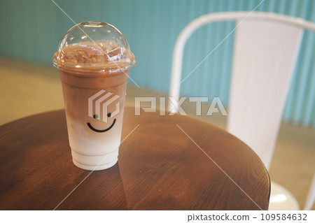 iced late in a transparent plastic container on cafe table outdoor iced late in a transparent plastic container on cafe table outdoor 109584632