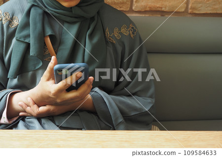 close up of women hand holding smart phone close up of women hand holding smart phone 109584633