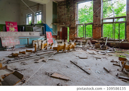 Abandoned building of former House of Culture in exclusion zone of Chernobyl, Belarus. Text on posters Abandoned building of former House of Culture in exclusion zone of Chernobyl, Belarus. Text on posters 109586135