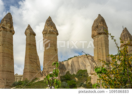 Unique geological formations in Love Valley in Cappadocia. Popular touristic area in Goreme, Nevsehir, Turkey Unique geological formations in Love Valley in Cappadocia. Popular touristic area in Goreme, Nevsehir, Turkey 109586883