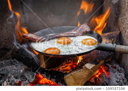Bacon and eggs and iron pan Bacon and eggs and iron pan 109587106