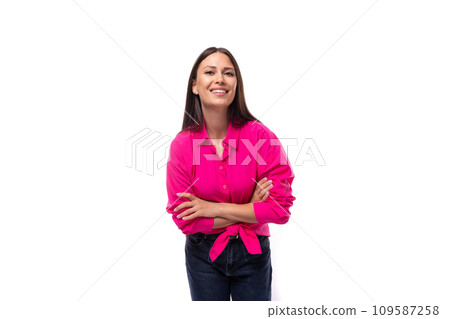 portrait of a young brunette secretary woman wearing a pink shirt tied at the waist 109587258