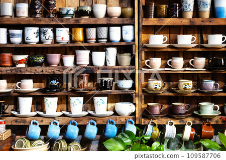 Small store with many pottery ceramic standing on shelves. Small store with many pottery ceramic standing on shelves. 109587706