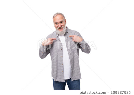 cute inspired active grandfather with white beard and mustache dressed in striped shirt and jeans 109587925