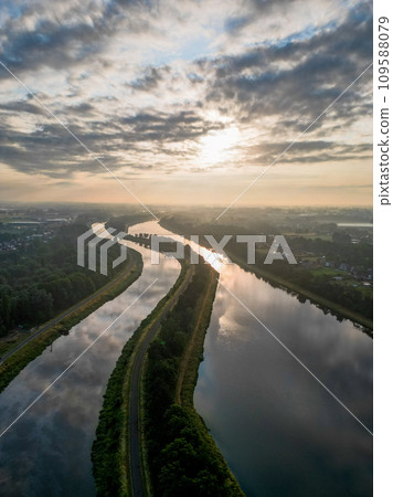 Morning Calm: Misty River at Sunrise Morning Calm: Misty River at Sunrise 109588079