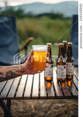 Beer on the table and camping party,hands toasting in beer, 109588889