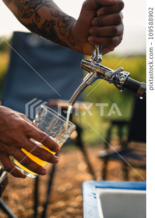 Beer on the table and camping party,hands toasting in beer, 109588902