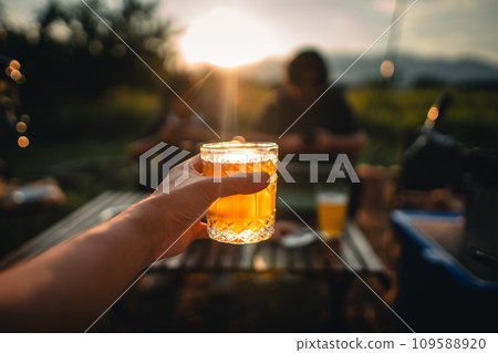Beer on the table and camping party,hands toasting in beer, 109588920