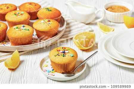 sweet lemon muffins on a plate, top view, close-up 109589989