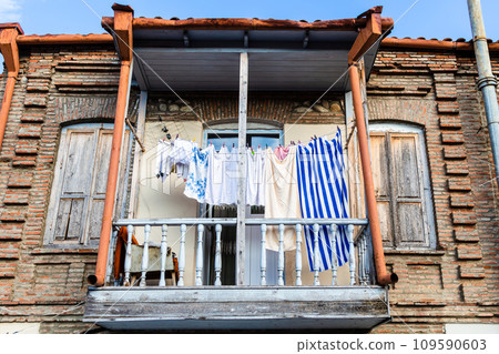 open balcony with drying clothes in Sighnaghi town open balcony with drying clothes in Sighnaghi town 109590603