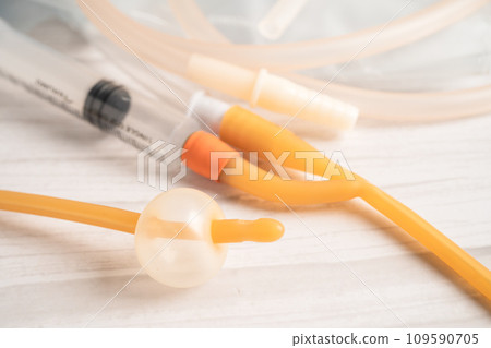 Foley urinary catheter with urine bag for disability or patient in hospital. 109590705