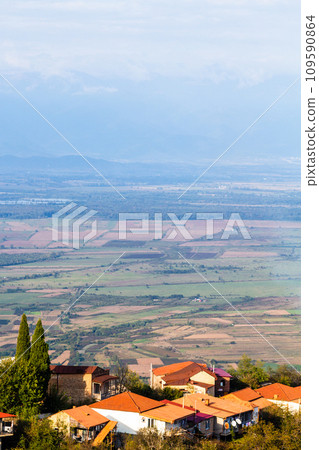 Sighnaghi town houses over Alazan plain at sunset 109590864