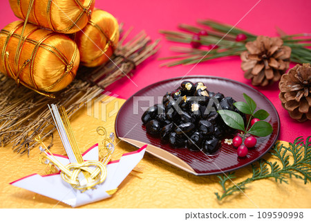 Traditional Japanese New Year dish, black beans, served with gold leaf Traditional Japanese New Year dish, black beans, served with gold leaf 109590998