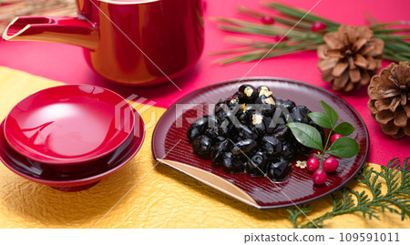 Traditional Japanese New Year dish, black beans, served with gold leaf 109591011