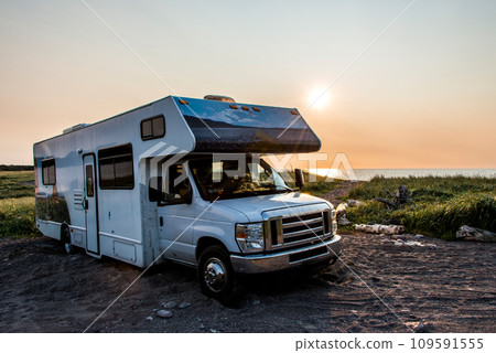 Camper RV truck parked at the Cape Breton Island Coast line Sunset cliff scenic Cabot Trail Nova Scotia Hghlands Canada 109591555