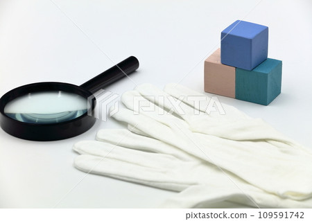Image of magnifying glass, gloves, and appraisal Image of magnifying glass, gloves, and appraisal 109591742