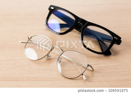 silver-rimmed and black-rimmed glasses silver-rimmed and black-rimmed glasses 109591875