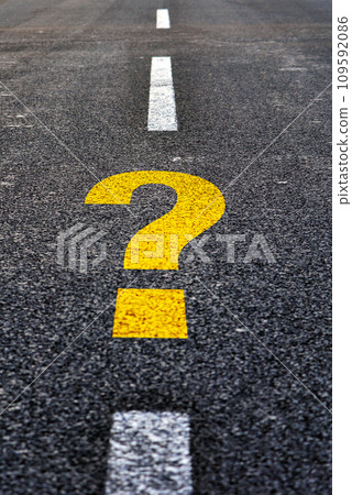 Question mark on asphalt road. Travel to unknown destination concept. 109592086