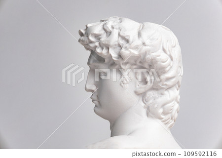 Statue. On a white isolated background. Gypsum statue of David's head. Man. Statue. On a white isolated background. Gypsum statue of David's head. Man. 109592116