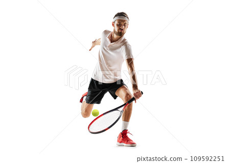 Competitive man, tennis player during game in motion, hitting ball with racket, playing isolated over white background. Sport Competitive man, tennis player during game in motion, hitting ball with racket, playing isolated over white background. Sport 109592251