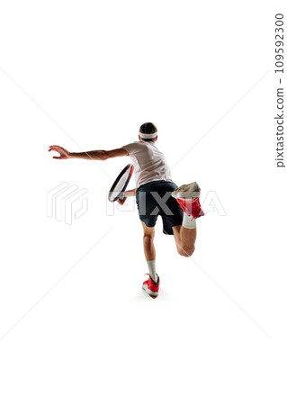 Back view image of young man in motion with racket, tennis player during game, training isolated over white background. Sport Back view image of young man in motion with racket, tennis player during game, training isolated over white background. Sport 109592300