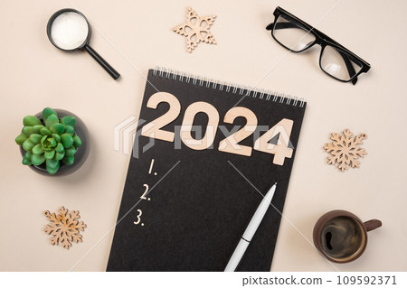 New Year Aims 2024. To Do List. Empty Notebook at the Desk with Holiday Decoration. Top view. Creating Plan, Resolution. New Life, Start Up, Beginning Concept. Business ideas. Goals, action, checklist New Year Aims 2024. To Do List. Empty Notebook at the Desk with Holiday Decoration. Top view. Creating Plan, Resolution. New Life, Start Up, Beginning Concept. Business ideas. Goals, action, checklist 109592371