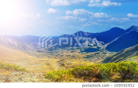 Mountain valley in the crater of an extinct volcano on Kamchatka peninsula Mountain valley in the crater of an extinct volcano on Kamchatka peninsula 109592952