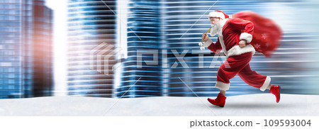 Santa Claus running with a sack full of Christmas presents in the city Santa Claus running with a sack full of Christmas presents in the city 109593004